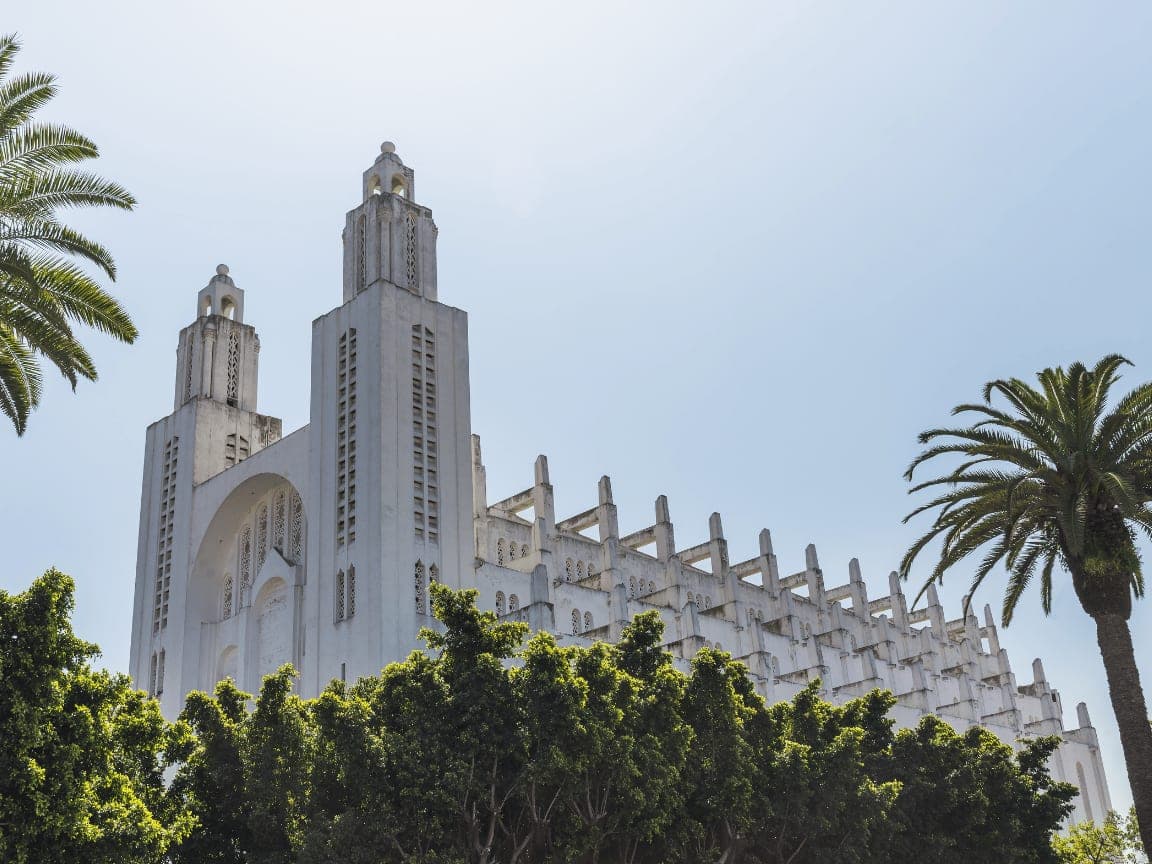 The Hassan II Mosque rising above palm trees, Casablanca